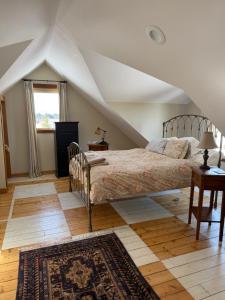 a bedroom with a large bed and a window at Yellowstone House in Livingston