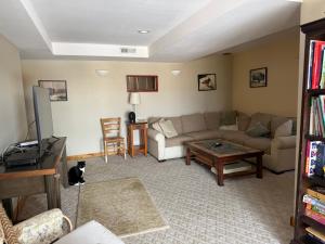 a living room with a couch and a table at Yellowstone House in Livingston +45 photos