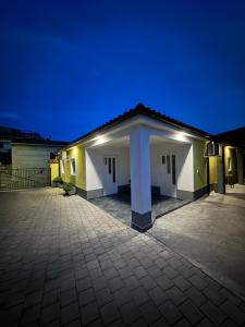 a building at night with a blue sky at Apartment Zart 1 in Dekani