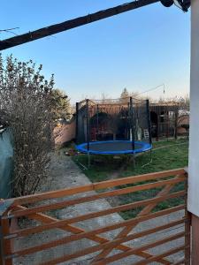 aenced in playground with a blue trampoline at DekaHome4you in Marten