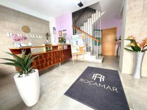 a hotel lobby with a frrocandan sign on the floor at Pensión Rocamar in Almuñécar
