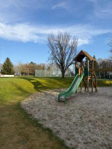 a playground with a slide in a park at Lavand'in Durbuy in Durbuy