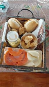 a lunch box filled with different types of food at Chalé dos Pellizzari in Monte Verde