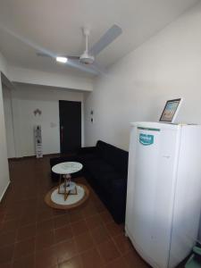 a living room with a couch and a table at GuestHouse Encanto del Centro 3 in Encarnación