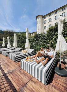 a group of people sitting on chaises on a patio at Hotel Le Provence - Restaurant Le Styx in La Palud-sur-Verdon +54 photos