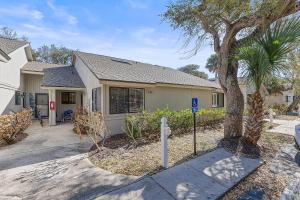 a house with a parking meter in front of it at Sea Woods Villa 4263 in New Smyrna Beach