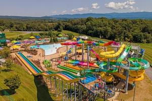 an aerial view of a water park with a water slide at Massanutten Chalet View & Fire Table Deck in McGaheysville