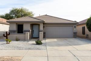 a house with a garage in front of it at Copper Cactus House Pool, Spa, Golf! in Queen Creek