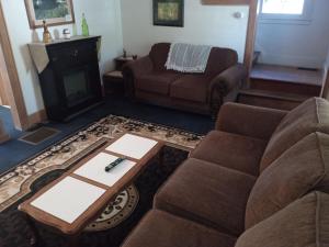 a living room with a couch and a coffee table at Altgeld House in South Bend
