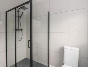 a shower in a bathroom with a toilet at Pirnies in Pitlochry +20 photos