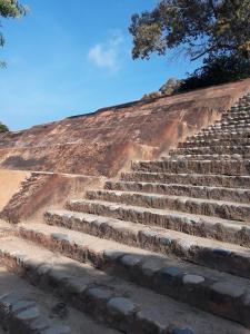 a set of stone stairs on a dirt hill at Tuya Casita in Zihuatanejo