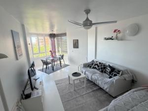 a living room with a couch and a table at Studio La Calita in Mijas Costa