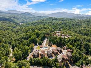 an aerial view of a mansion in the mountains at Luxury Chalet w Indoor Pool, Theater Room & Game Loft — 4 Miles to Gatlinburg in Gatlinburg +54 photos