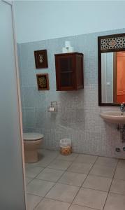 a bathroom with a toilet and a sink at Complejo Turístico Fuenmayor in Torres +44 photos