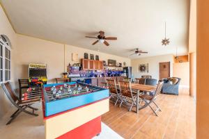 a living room with a ping pong table at Casa Bella Noche Isla Mujeres in Isla Mujeres