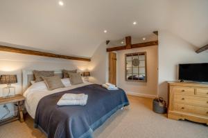 a bedroom with a large bed and a television at 3 Bed in Sedgehill oc-b34698 in Sedghill