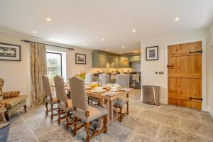 a kitchen and dining room with a table and chairs at 3 Bed in Sedgehill oc-b34698 in Sedghill