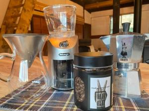 a table with a blender and a coffee maker at La Cachette - Vacation STAY 34953v in Ina +12 photos
