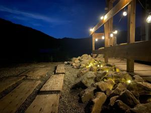 a group of rocks on a dock at night at La Cachette - Vacation STAY 34953v in Ina