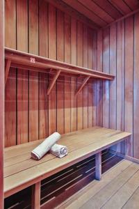 a sauna with a wooden bench in a room at Le gîte l'écureuil in Malmedy +14 photos