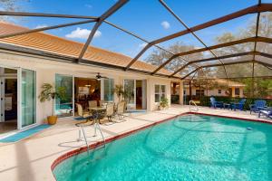 a swimming pool in a house with an open ceiling at Golfer's Oasis w/ Pool in Black Diamond Ranch! in Lecanto