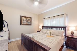 a bedroom with a large bed and a window at Golfer's Oasis w/ Pool in Black Diamond Ranch! in Lecanto +17 photos