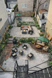 an overhead view of a patio with furniture and tables at Jefferson - 20 mins to Manhattan, NYC in West New York