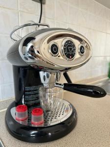 a kitchen mixer sitting on top of a counter at The Clock House No1 in Grevena +2 photos