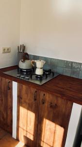 a kitchen counter with two pots and pans on it at MOZa LUZe - Off Grid Casa Rural in El Pilar y Provincias +21 photos