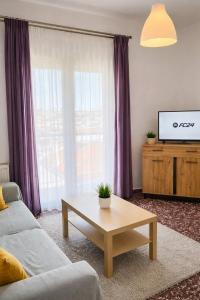 a living room with a couch and a coffee table at Skiathos home with the best view in Skiathos
