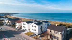 an aerial view of a town with the ocean at Strandvilla GLOWE - Strandjuwel in Glowe