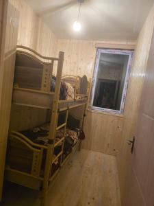 a room with two bunk beds and a mirror at goderdzi booking in Goderdzi +1 photo