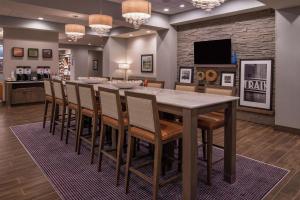 a dining room with a large table and chairs at Hampton Inn Benson in Benson