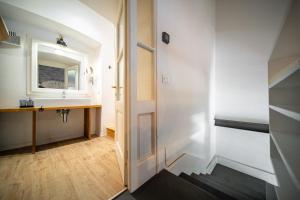 a bathroom with a sink and a mirror at Cosy Moods - OldTown in Trieste +57 photos