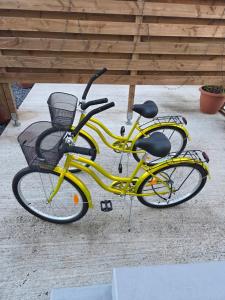 two yellow bikes parked next to each other at AK Lodge Raiatea in Raiatea