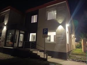 a building with a parking sign in front of it at Apartmány ARIES in Nitra +9 photos
