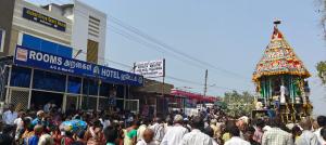 a crowd of people walking down a busy street at Lakshmi Divya Guest house in Pedda Ahobilam