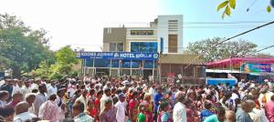 a large crowd of people standing in front of a building at Lakshmi Divya Guest house in Pedda Ahobilam