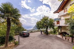 a car parked on the side of a road at Villa Dream alla Beppa in Tenno