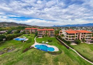 an aerial view of a resort with two swimming pools at Punta Mita 4BR Paradise Golf Course Views in Punta Mita