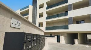 a building with a clock on the side of it at Oris in Oristano +20 photos