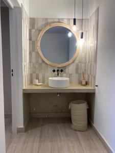 a bathroom with a sink and a mirror at Senderos del Mar II in Monte Hermoso +13 photos