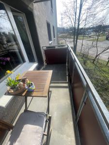 a patio with a table and chairs on a balcony at Ferienwohnung Emma in Castrop-Rauxel