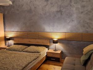 a bedroom with two beds and two lamps at Apartmán CENTRAL, near the center, self check in 24 h, free parking in Banská Bystrica