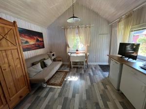 a living room with a couch and a table at Juka in Palanga