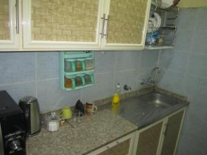 a kitchen with a sink and a counter top at العين الهيلي المصباح ب ب 9 in Al Ain