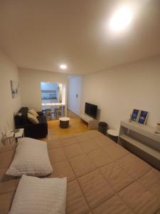 a living room with two beds and a couch at Monoambiente Evanz in Ciudad Lujan de Cuyo