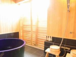 a bathroom with a large tub and two stools at scene - Vacation STAY 52647v in Daisen