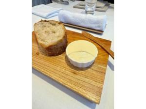 a loaf of bread on a cutting board with a bowl of butter at scene - Vacation STAY 52647v in Daisen +8 photos