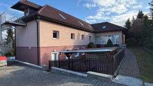 a house with a pool in front of it at Ubytování Divišov in Divišov